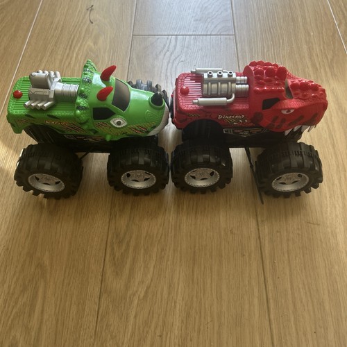 Two large monster trucks - large,